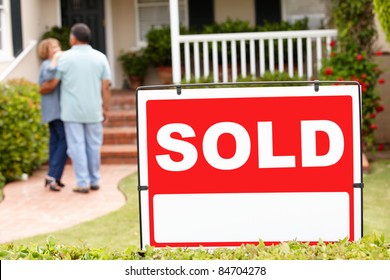 Senior Hispanic Couple Moving Into New Home