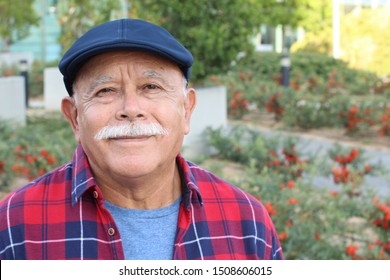 Senior Hispanic man outdoor headshot 