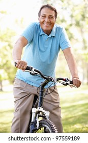 Senior Hispanic Man Riding Bike