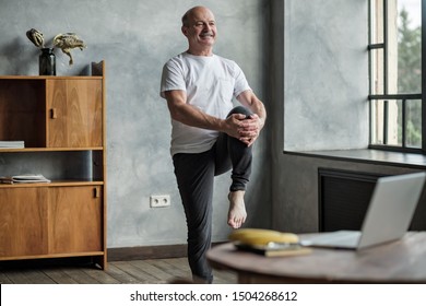 Senior Hispanic Man Standing In One Leg Yoga Balance. Healthy Lifestyle At Old Age