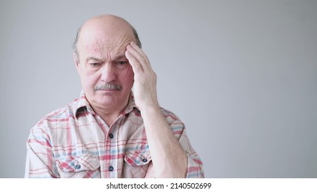 Senior hispanic man trying to remember something or having terrible headache. - Shutterstock ID 2140502699