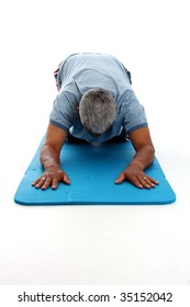 Senior Hispanic Man Working On A White Background