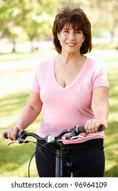 Senior Hispanic Woman With Bike