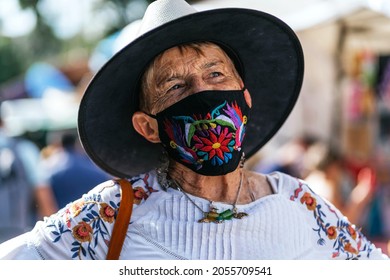 Senior Hispanic Woman With Mask