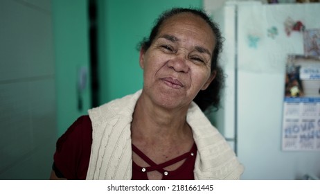 A Senior Hispanic Woman Portrait Face Looking At Camera With Serious Expression