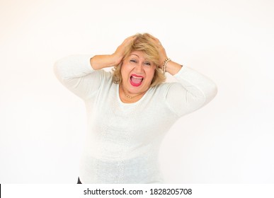 Senior Hispanic Woman With Shocked Expression Isolated On A White Background