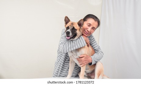 Senior Hugging Dog In Smiling Face, White Background Copy Space