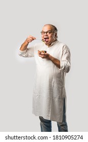 Senior Indian Asian Man Eating Fresh Green Salad. Mature Male Male Having Healthy Snack, Healthcare, Diet Concept