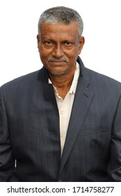 Senior Indian man cropped portrait view with happy or smiling expression on white background.