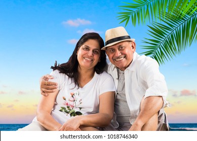 Senior Indian/Asian couple at beach - Powered by Shutterstock