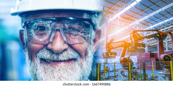 Senior Industry factory Engineer Man monitoring upgrade of robotic in factory by digital hologram glasses.Robot technology of future factory and futuristic industry concept.