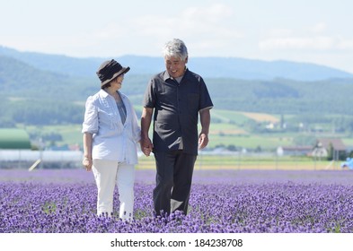 Senior Japanese couple in the lavender field - Powered by Shutterstock