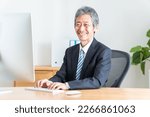 Senior Japanese man in a suit