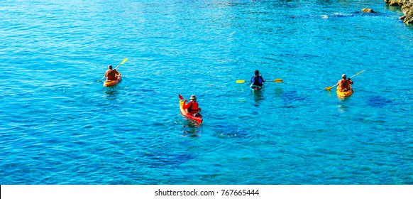 Senior kayaker on a kayak by the sea, active water sport and leisure, kayaking - Powered by Shutterstock