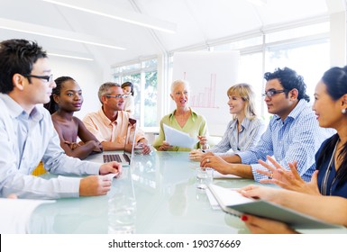 Senior Lady Giving an idea to her Colleagues - Shutterstock ID 190376669