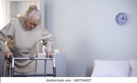 Senior Lady Learning Walk With Frame, Rehabilitation After Hip Joint Replacement