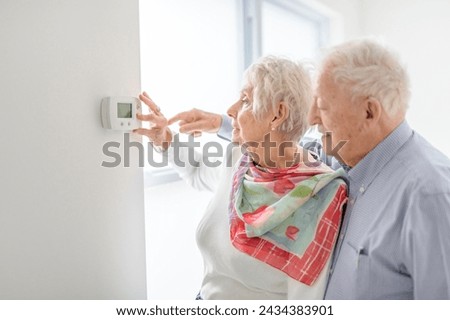 Similar – Caregiver looking through the window with elderly patient in wheelchair