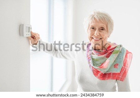 Similar – Caregiver looking through the window with elderly patient in wheelchair