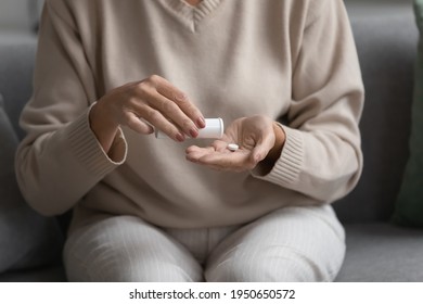 Senior Lady Treatment Of Dementia, Pain, Infection, Elderly Mental Disease, Relieving Menopause, Anxiety Symptoms. Hands Of Woman Holding Tube And Daily Dose Of Pills. Healthcare Concept. Close Up