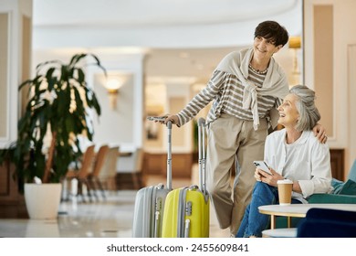 A senior lesbian couple, one standing, one with a suitcase, in a sweet moment. - Powered by Shutterstock