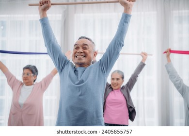 Senior lifestyle at home. Older adults exercise at their houses. Senior exercising at a convalescent facility.  - Powered by Shutterstock