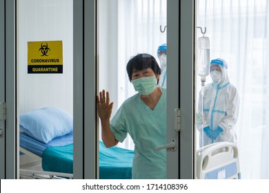 A Senior Lonely Sad Asian Woman Infected With Covid-19 Or Coronavirus Was Admitted And Quarantined In The Isolation Room In Hospital. She Was Waiting For Her Family To Visit 