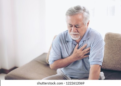 Senior Male Asian Suffering From Bad Pain In His Chest Heart Attack At Home - Senior Heart Disease