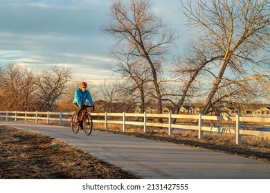 Senior Male Cyclist Is Riding A Gravel Bike On One Of Numerous Bike Trails In Northern Colorado In Fall Or Winter Scenery - Poudre River Trail Near WIndsor