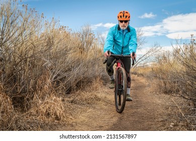 Senior Male Cyclist Is Riding A Gravel Bike On A Single Track Trail In Winter Or Fall Scenery - Arapaho Bend Natural Area In Fort Collins, Colorado