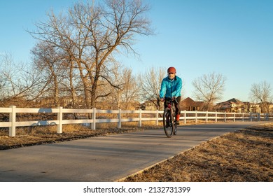 Senior Male Cyclist Is Riding A Gravel Bike On One Of Numerous Bike Trails In Northern Colorado In Fall Or Winter Scenery - Poudre River Trail Near WIndsor