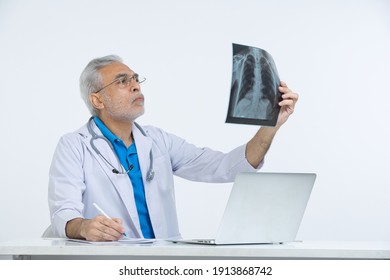 
Senior male doctor analyzing x-ray image in hospital. - Powered by Shutterstock