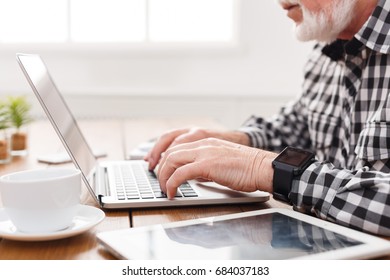 Senior Male Hands On Laptop Closeup. Unrecognizable Bearded Mature Man Typing On Computer Keyboard