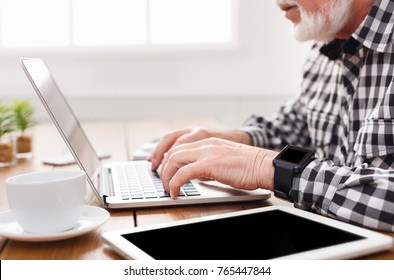 Senior Male Hands On Laptop Closeup. Unrecognizable Bearded Mature Man Typing On Computer Keyboard