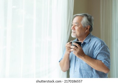 Senior male , old man feel happy drinking coffee in the morning, enjoying time in his home indoor background - lifestyle senior happiness concept - Powered by Shutterstock