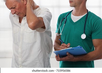 Senior Male Patient Suffering From Back Pain During Medical Exam. Chiropractic, Osteopathy, Physiotherapy. Alternative Medicine, Pain Relief Concept