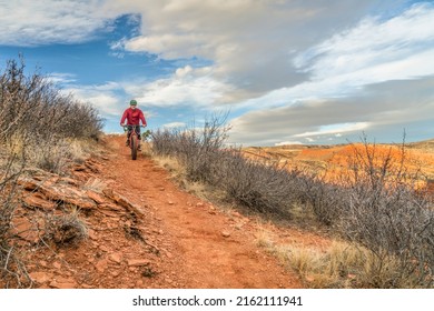 A Senior Male Riding A Fat Mountain Bike On A Single Track Trail In Red Mountain Open Space In Colorado, Late Fall Scenery