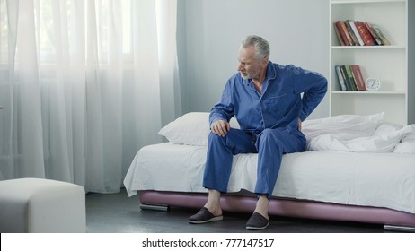 Senior Male Suffering Sharp Back Pain, Sick Person Getting Up From Bed, Morning