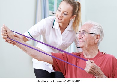 Senior Male Working With Physiotherapist