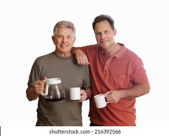 Senior man and adult son holding mugs and coffeemaker, smiling, portrait, cut out - Powered by Shutterstock