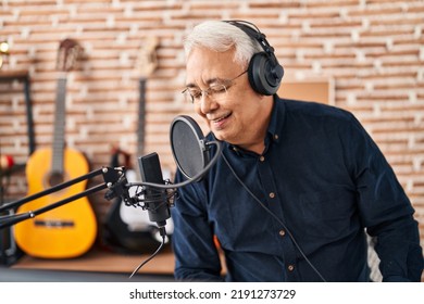 Senior Man Artist Singing Song At Music Studio