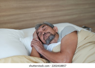 Senior Man Asleep On The Bed,older Adult Asian Man Sleeping Comfortably In Blanket. Concept Elderly People Lifestyle, Get Enough Rest,health Care                                