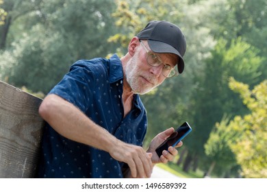 old man in a baseball cap