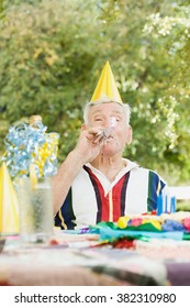 Senior Man At A Birthday Party