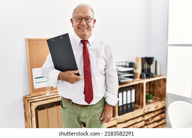 Senior Man Business Worker Holding Clipboard At Office