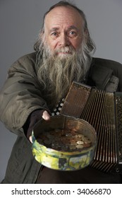 Senior Man Busking With Accordian