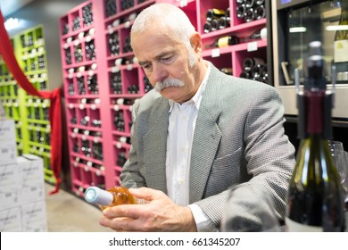 Senior Man Buying Whisky