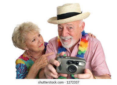 A senior man with a camera taking pictures of pretty girls on the beach while his wife gets mad at him. - Powered by Shutterstock