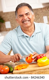 Senior Man Chopping Vegetables