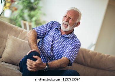 Senior Man With Chronic Knee Problems And Pain