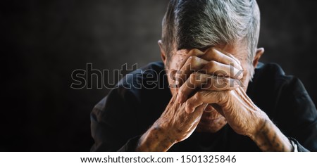 senior man covering his face with his hands. Depression and anxiety Copy space.